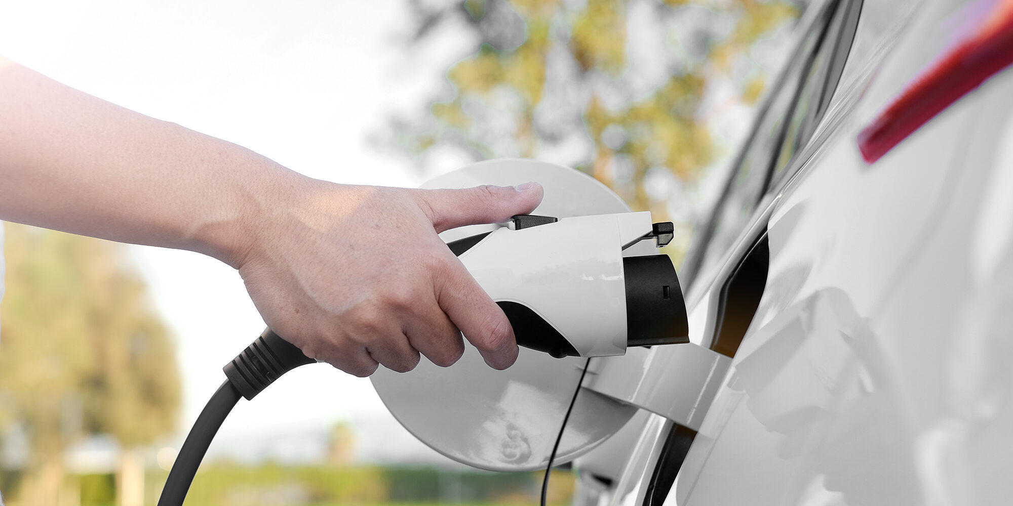 Electric car or ev is charging at station . Top Gas Station Chargers